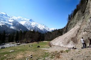 a group of people standing on a hill near a mountain at Vert Lodge Chamonix in Chamonix-Mont-Blanc