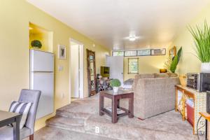 a living room with a couch and a table at Hale Moi 102B in Princeville