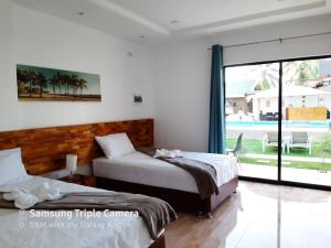 Кровать или кровати в номере Chinita Boutique Hotel