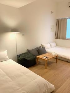 Ένα ή περισσότερα κρεβάτια σε δωμάτιο στο 小巷旺宅 X 旺福