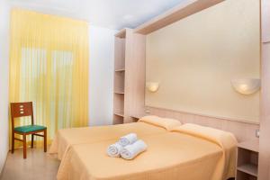 Säng eller sängar i ett rum på Apartaments Costa d'Or