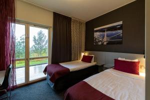 Postel nebo postele na pokoji v ubytování Hotell Höga Kusten