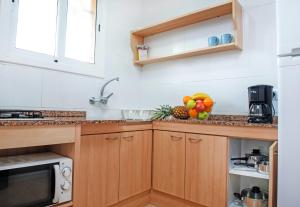 Kuchyň nebo kuchyňský kout v ubytování Apartaments Costa d'Or