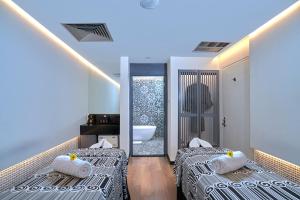 Кровать или кровати в номере Hard Rock Hotel Bali 