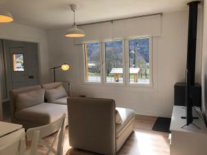 a living room with a couch and a table at Les casetes Vall de Boi in Barruera