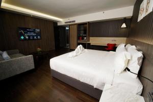 Postel nebo postele na pokoji v ubytování Jazz Hotel Penang
