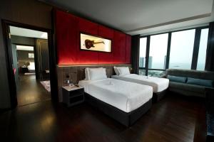 Postel nebo postele na pokoji v ubytování Jazz Hotel Penang