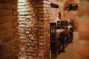 Reštaurácia alebo iné gastronomické zariadenie v ubytovaní Aparthotel Oberża