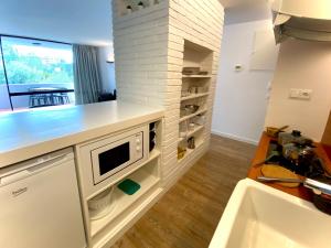 Kuchyň nebo kuchyňský kout v ubytování Apartment SunClub CalaVinya