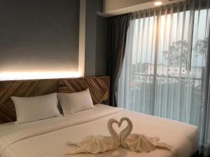 Postel nebo postele na pokoji v ubytování OU HOTEL