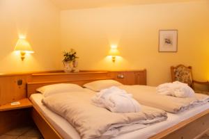 Postel nebo postele na pokoji v ubytování DEVA Achentaler Vitalhotel