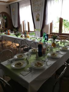 a long table with plates of food on it at Hotel Gryf in Gryfice