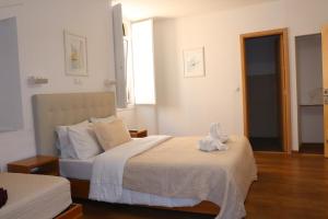 Un ou plusieurs lits dans un hébergement de l'établissement Hotel Belém Tejo - Setubalense