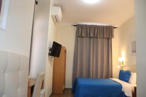 Un ou plusieurs lits dans un hébergement de l'établissement Hotel Belém Tejo - Setubalense