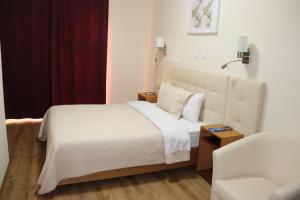 Un ou plusieurs lits dans un hébergement de l'établissement Hotel Belém Tejo - Setubalense
