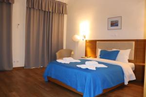 Un ou plusieurs lits dans un hébergement de l'établissement Hotel Belém Tejo - Setubalense