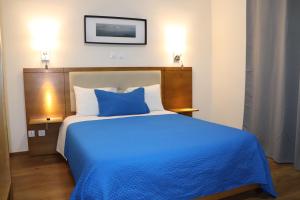 Un ou plusieurs lits dans un hébergement de l'établissement Hotel Belém Tejo - Setubalense