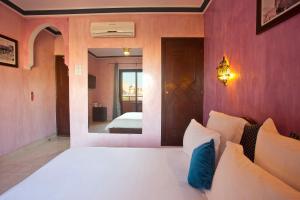 Postel nebo postele na pokoji v ubytování Amani Hotel Suites & Spa
