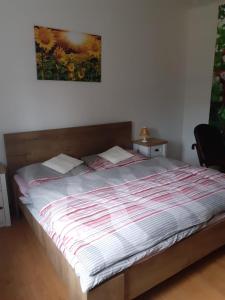 Postel nebo postele na pokoji v ubytování Apartman Ema