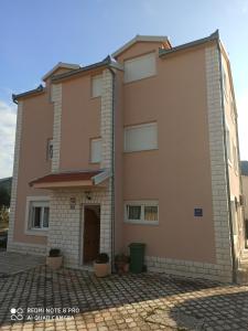 an image of a house with a garage at Apartments Ana in Grebaštica