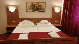 Postel nebo postele na pokoji v ubytování Diana Club Hotel