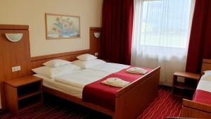 Postel nebo postele na pokoji v ubytování Diana Club Hotel
