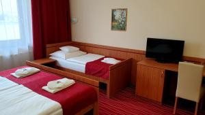 Postel nebo postele na pokoji v ubytování Diana Club Hotel