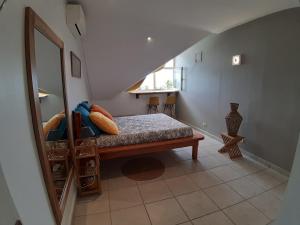 Postel nebo postele na pokoji v ubytování La Kaz du Lagon