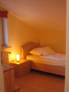 Tempat tidur dalam kamar di Ferienwohnung Haus Datz in Berchtesgaden