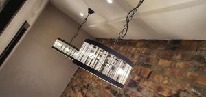 a chandelier hanging from the ceiling in a room at The Lord Street Hotel; BW Signature Collection in Southport