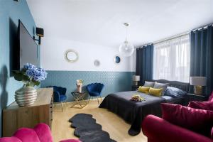 a living room with a bed and a couch at ClickTheFlat Palace of Culture View Apartment - Marszałkowska St. in Warsaw