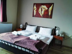 Voodi või voodid majutusasutuse Pension Tilly toas