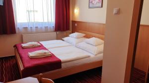 Postel nebo postele na pokoji v ubytování Diana Club Hotel