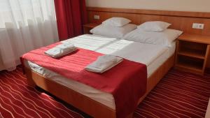 Postel nebo postele na pokoji v ubytování Diana Club Hotel