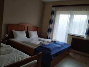 Voodi või voodid majutusasutuse Pension Tilly toas