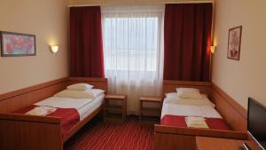 Postel nebo postele na pokoji v ubytování Diana Club Hotel