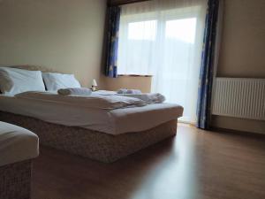 Voodi või voodid majutusasutuse Pension Tilly toas