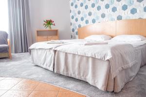 Posteľ alebo postele v izbe v ubytovaní AL-DOM apartamenty Olymp Błękitna Laguna