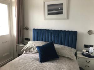 Postel nebo postele na pokoji v ubytování Lazy Waves Boutique B&B