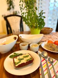 a table with a piece of cake on a plate at Green Oasis in Sladki Vrh