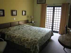 Ein Bett oder Betten in einem Zimmer der Unterkunft Mariá Plaza Hotel