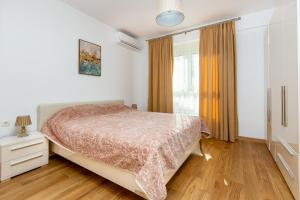Postel nebo postele na pokoji v ubytování Apartments LM RESIDENCE