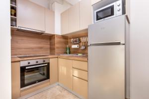Kuchyň nebo kuchyňský kout v ubytování Apartments LM RESIDENCE