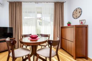 TV a/nebo společenská místnost v ubytování Apartments LM RESIDENCE
