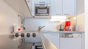 Kuchyň nebo kuchyňský kout v ubytování Appartement Berge