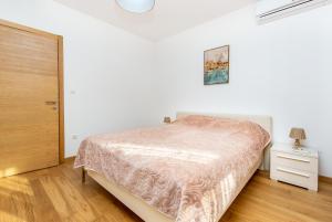 Postel nebo postele na pokoji v ubytování Apartments LM RESIDENCE