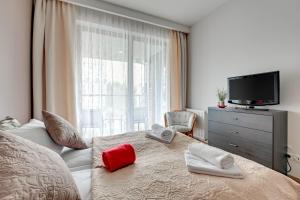 Posteľ alebo postele v izbe v ubytovaní Apartments RIVA - Nadmorski Dwór Premium