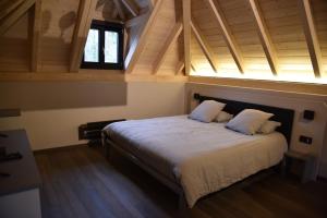 a bedroom with a large bed in a attic at Airfield - Airport in Luxembourg