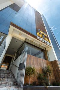 a building with a sign on the side of it at Costa Del Inka Hotel in Urbanizacion Buenos Aires