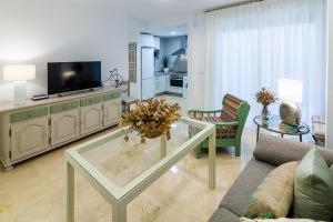 Televízia a/alebo spoločenská miestnosť v ubytovaní Apartamento Emilio Luque Cinco